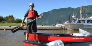 GK Nicholl in a canoe